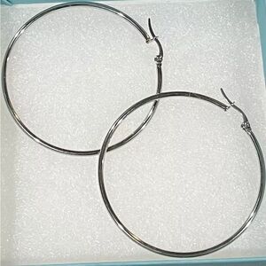 Off Park large Silver tone stainless steel hoop earrings 2” Diameter.